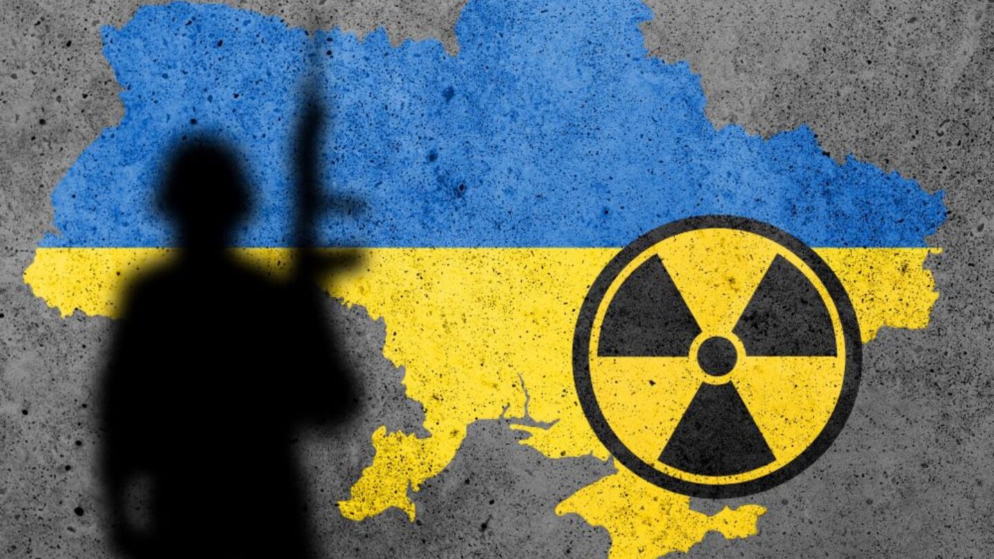 Flag map of Ukraine painted on a concrete wall with Zaporizhzhia Nuclear Power Plant